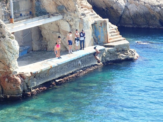 P3225541 Boy-jumping-into-sea-near-Castel-beach